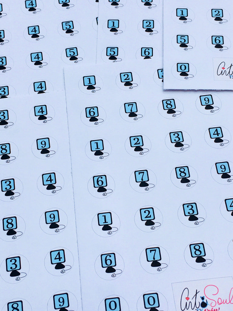 A close up of the Computer Rotation Day stickers.  Each sticker is an image of a computer with the rotation day number written on the monitor.