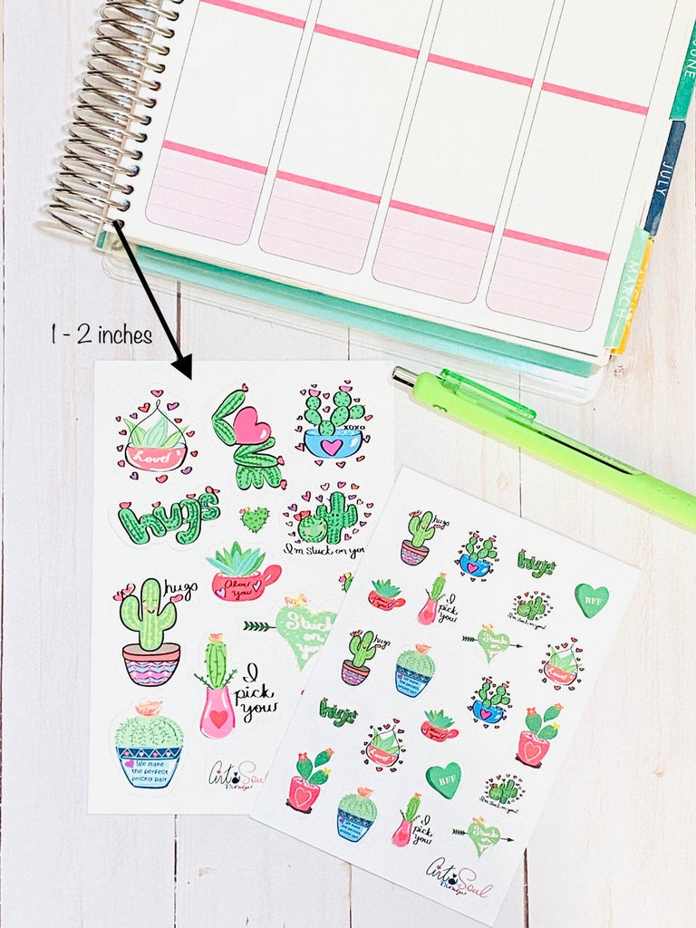 A sheet of regular sized cactus valentine stickers and a sheet of mini size cactus valentine stickers for comparison.  The regular sized stickers are 1 to 2 inches in size.  The mini size stickers are around 0.5 inches in size.